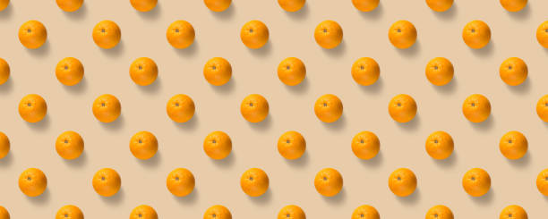 istock Fruit pattern of fresh oranges on yellow background. Pop art design, creative summer concept. 2170659552