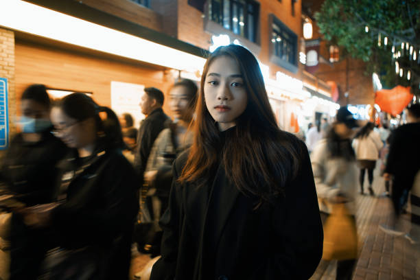 istock Beautiful women shopping at night 2170661419