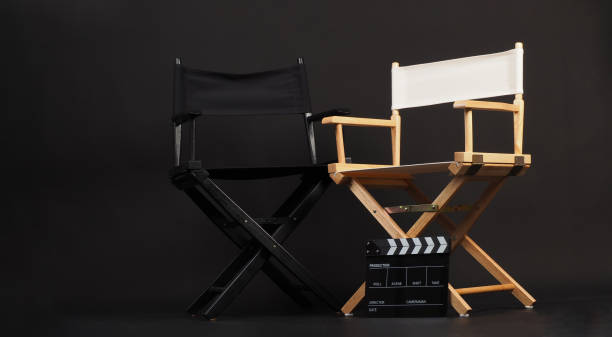 istock Two director chair with clapper board on black background 2170661543