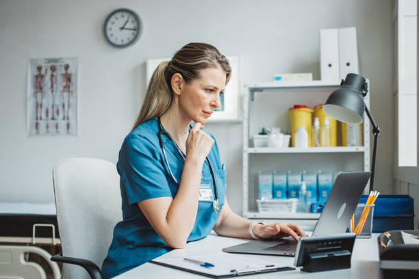 istock Female doctor sitting behind desk in office 2170662643