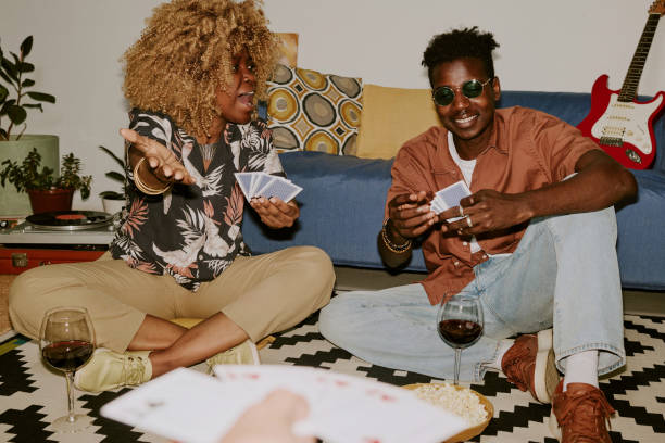 istock Friends Playing Cards on Floor 2170662923