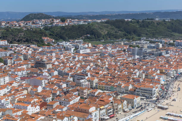 istock Orange rooftops beach and mountains of Nazare. 2170663081