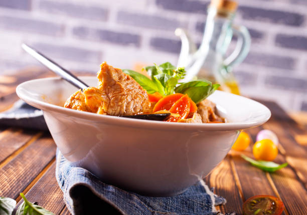 Homemade meat and vegetable stew or soup with tomato and spice