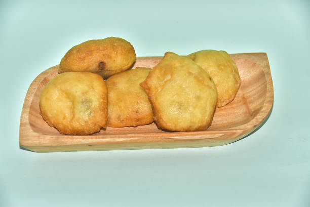 istock Round fried bread on a plate on a light blue background, isolated. 2170669579