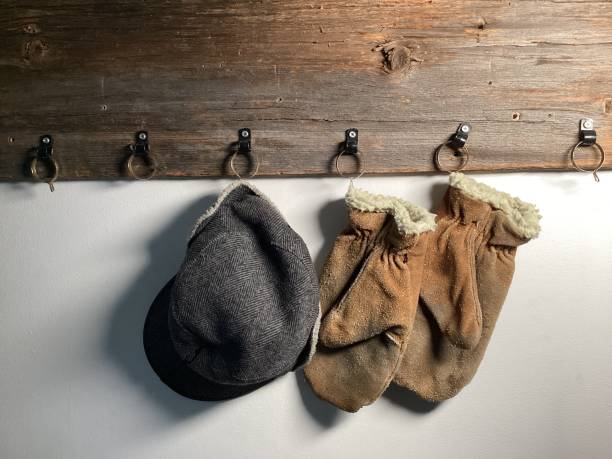 Rustic wooden coat rack with cap and mittens