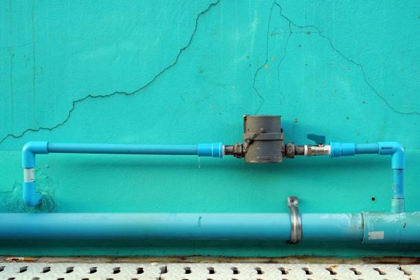 istock A water meter installed on the green cement wall for background and textured. 2170681537