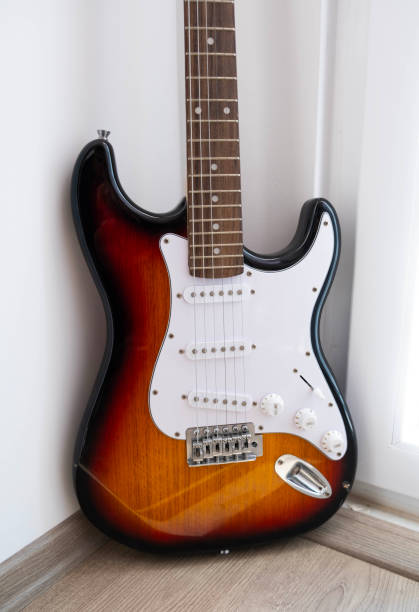 istock bass guitar brown and white 2170682223