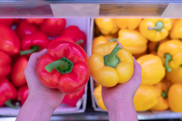 Child's hand holding paprika