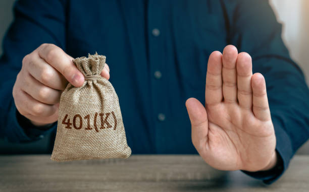 istock Features of a 401k retirement plan. Feature warnings. Advantages and disadvantages. Suspension of the pension savings program. Risks. A financial advisor advises caution. 2170683503