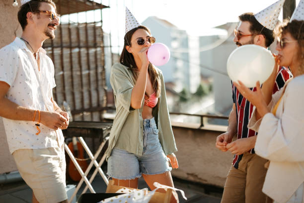 istock Group of young people partying on the rooftop 2170684526