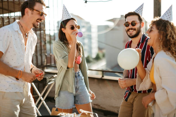 istock Group of young people partying on the rooftop 2170684527