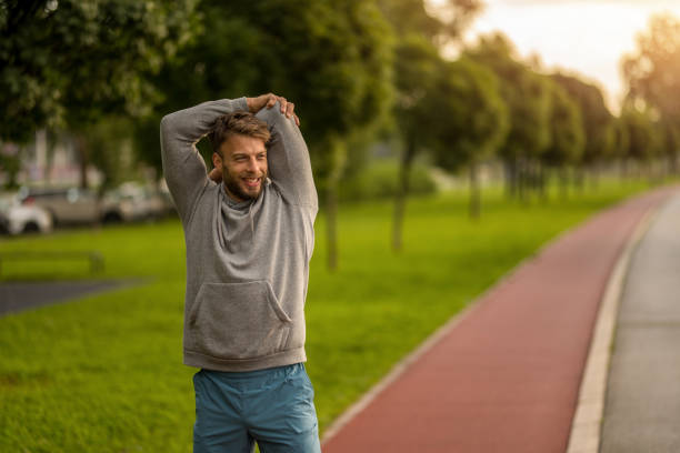 istock Athletic man stretching during outdoor exercise in the morning. 2170686190