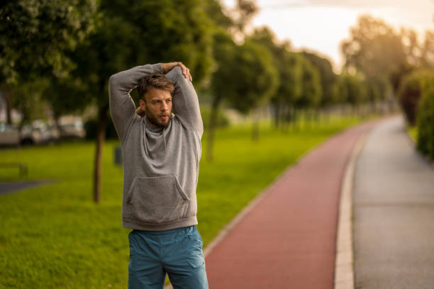 istock Athletic man stretching during outdoor exercise in the morning. 2170686254
