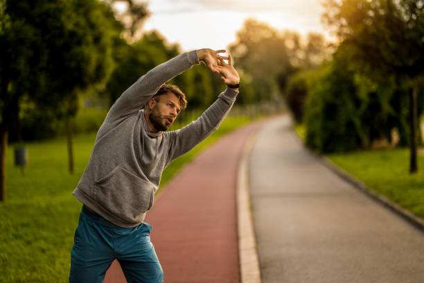 istock Athletic man stretching during outdoor exercise in the morning. 2170686581