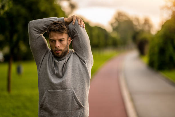 istock Athletic man stretching during outdoor exercise in the morning. 2170686952