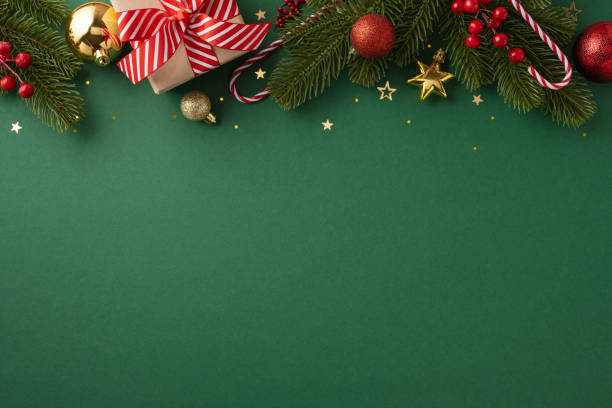 istock Christmas themed background featuring ornaments, a gift box with a red ribbon, and pine branches for seasonal decorations 2170688144