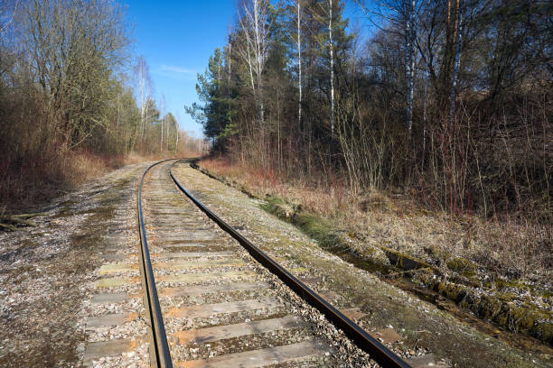 istock Railway track in the spring forest with blue sky with railway drainage system rail construction. Rail trackside drainage. Drainage channels of railway. 2170688458