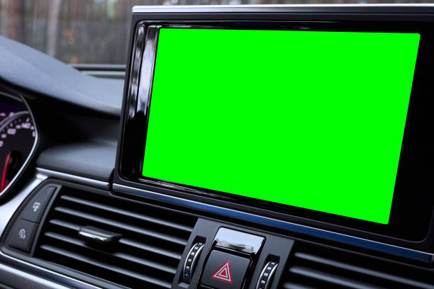 istock Monitor in car isolated blank screen for navigation maps and GPS rearview camera and parking assistant. Car display with blank green screen for design mock up, copy space. 2170690397