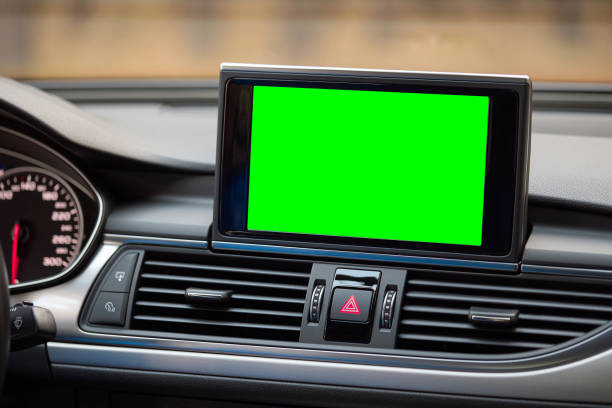 istock Monitor in car isolated blank screen for navigation maps and GPS rearview camera and parking assistant. Car display with blank green screen for design mock up, copy space. 2170690400