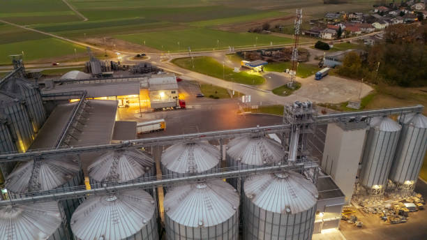 istock High Angle view of Illuminated Silos on Agricultural Landscape during Sunset 2170690830