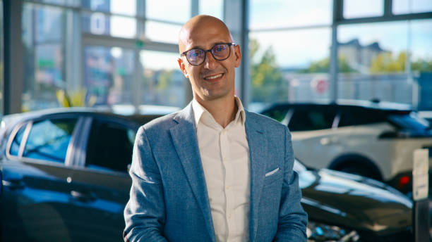 istock Successful Salesman Working in Modern Car Showroom 2170691974