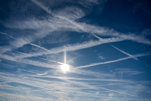 Contrails from airplanes in the sunny sky