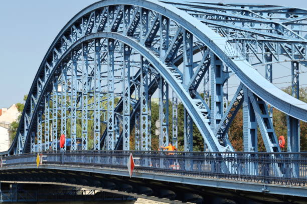 Blue riveted steel bridge in the city.