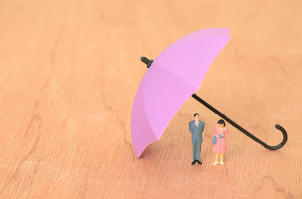 istock A strong umbrella of insurance protects businesses from unexpected storms, shielding both businessmen and businesswomen from financial downpours 2170692981