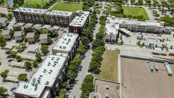 istock Rooftop packaged AC, furnace units at multistory modern urban apartment complex with covered carport near Keller Texas town center square walking jogging trails, retail shops, restaurants, aerial 2170693293