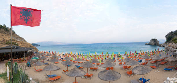 Ionian Sea, mirror beach Saranda, Albania, most beautifully beach, crystal clear sea, beach umbrella