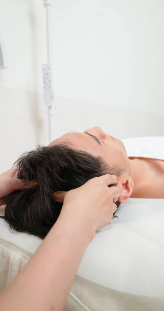 istock asian masseurs massage client head 2170694866