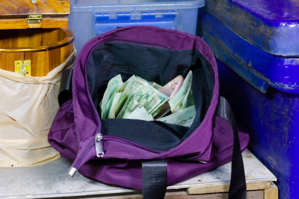 3d rendering of three canvas money bags with dollar symbols and red title \