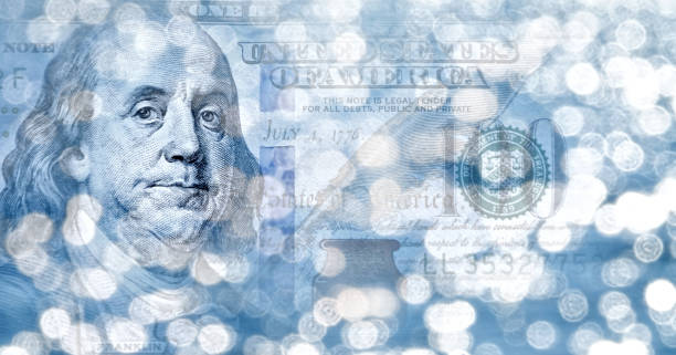istock Conceptual one hundred dollar bill in glowing lights background 2170698189