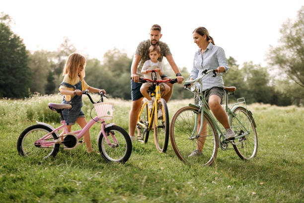 istock Family riding bicycles in the forest 2170704763