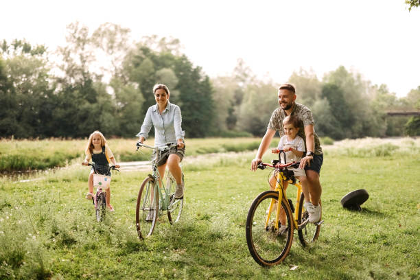 istock Family riding bicycles in the forest 2170704764