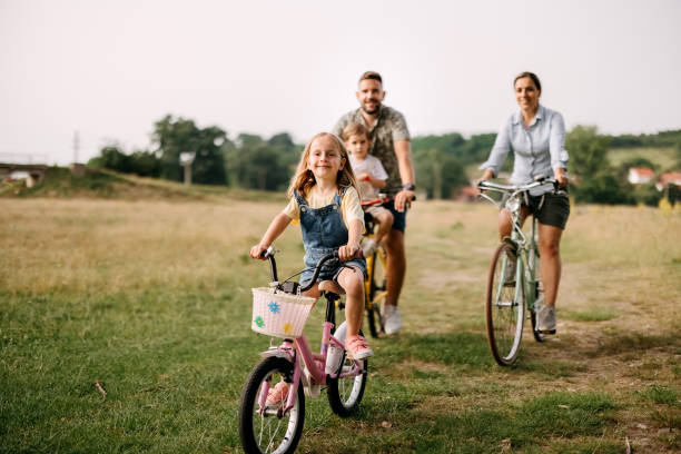istock Family riding bicycles in the forest 2170704780