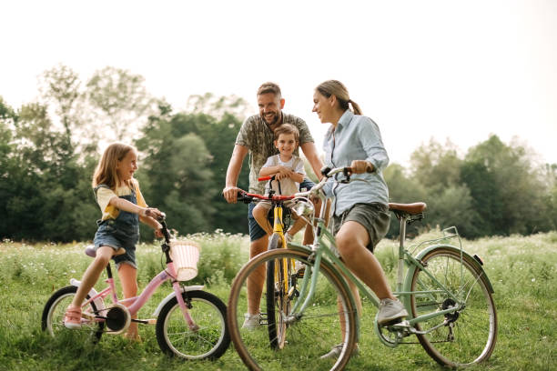 istock Family riding bicycles in the forest 2170704796
