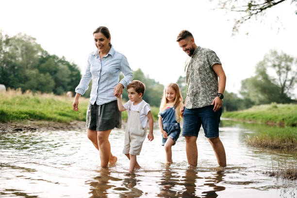 istock Family is walking along the river 2170704867