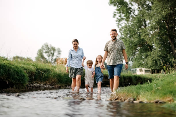 istock Family is walking along the river 2170704895