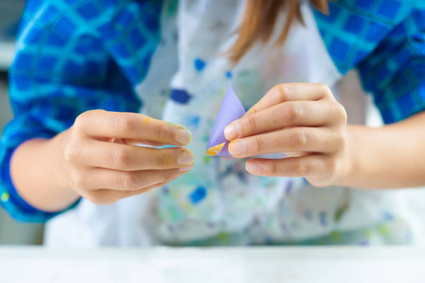 istock child folds paper 2170706941