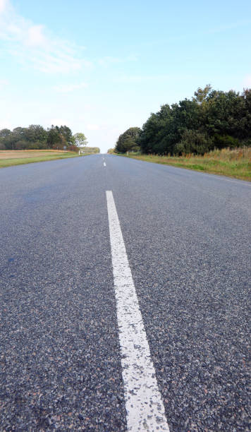 istock asphalt road without people in the plain and it seems to have no end 2170714530