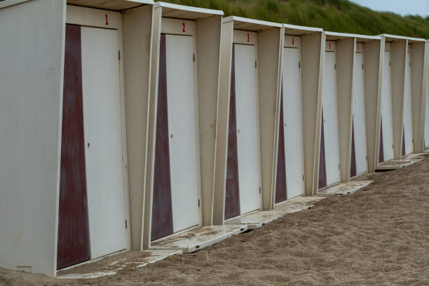 a row of changing cabins on the beach