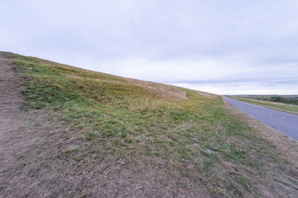 istock lonely cycle path and road in the Schoorlse Duinen, Netherlands 2170714857