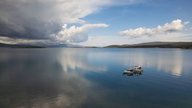 A small boat at beach of Urla, izmir. beautiful clouds