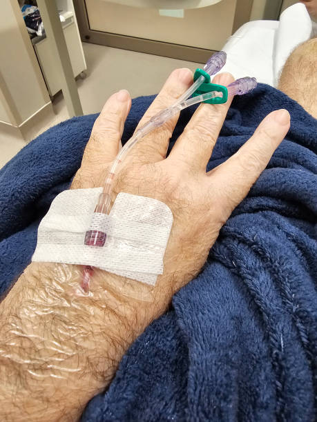 Patient is lying in a hospital bed
