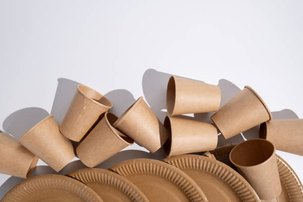 istock Kraft paper tableware: cups, food boxes, isolated on a light background. A set of various disposable tableware. Recycling and zero waste concept. Mock up 2170726258