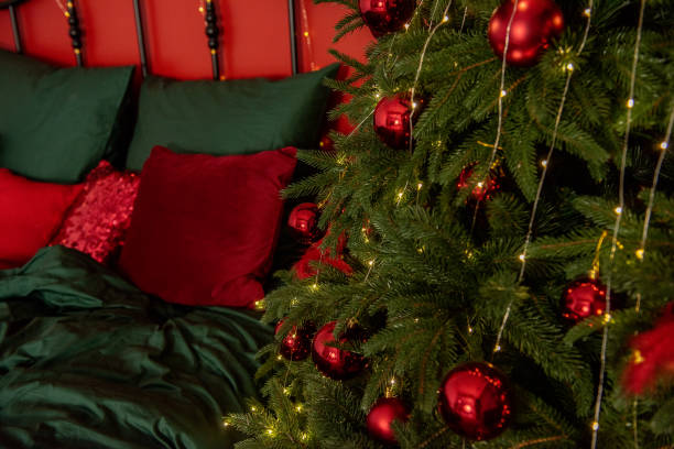 istock Close-Up of Christmas Tree and Festive Bed Decor 2170728422
