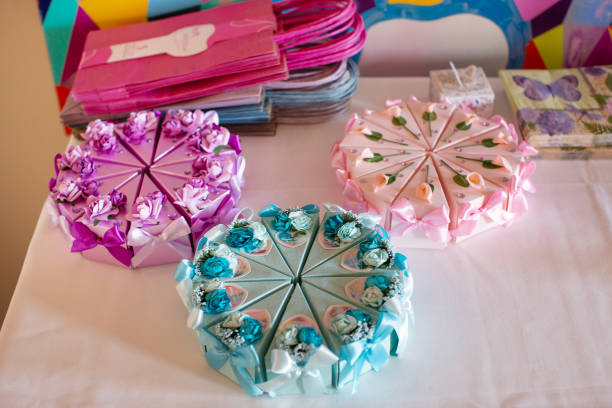 Various blue and gold birthday decoration is set on a dining room table during a home birthday party.