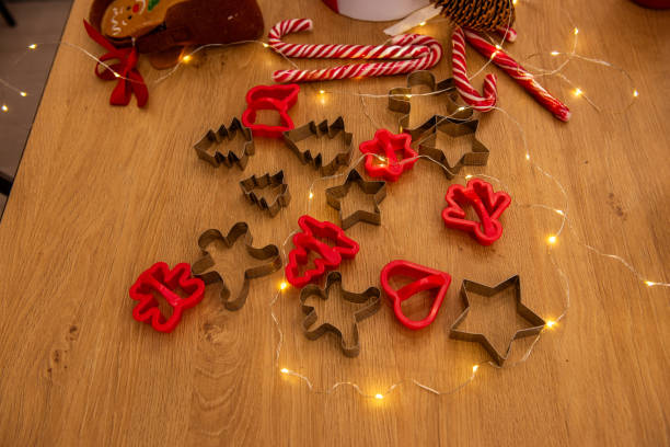 istock Christmas cookie cutters and festive decorations on a wooden table 2170730105