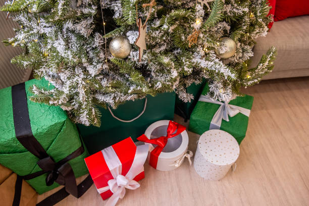 istock Christmas Tree with Wrapped Gifts Underneath 2170730321